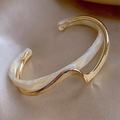 Elegant open bracelet with white enamel and gold