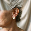 Elegant gold earrings in the shape of flower petals – image 2