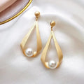 Earrings with crystals and round pearls – image 3