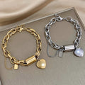 Thick heart bracelet in gold – image 3