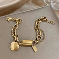 Thick heart bracelet in gold – image 4